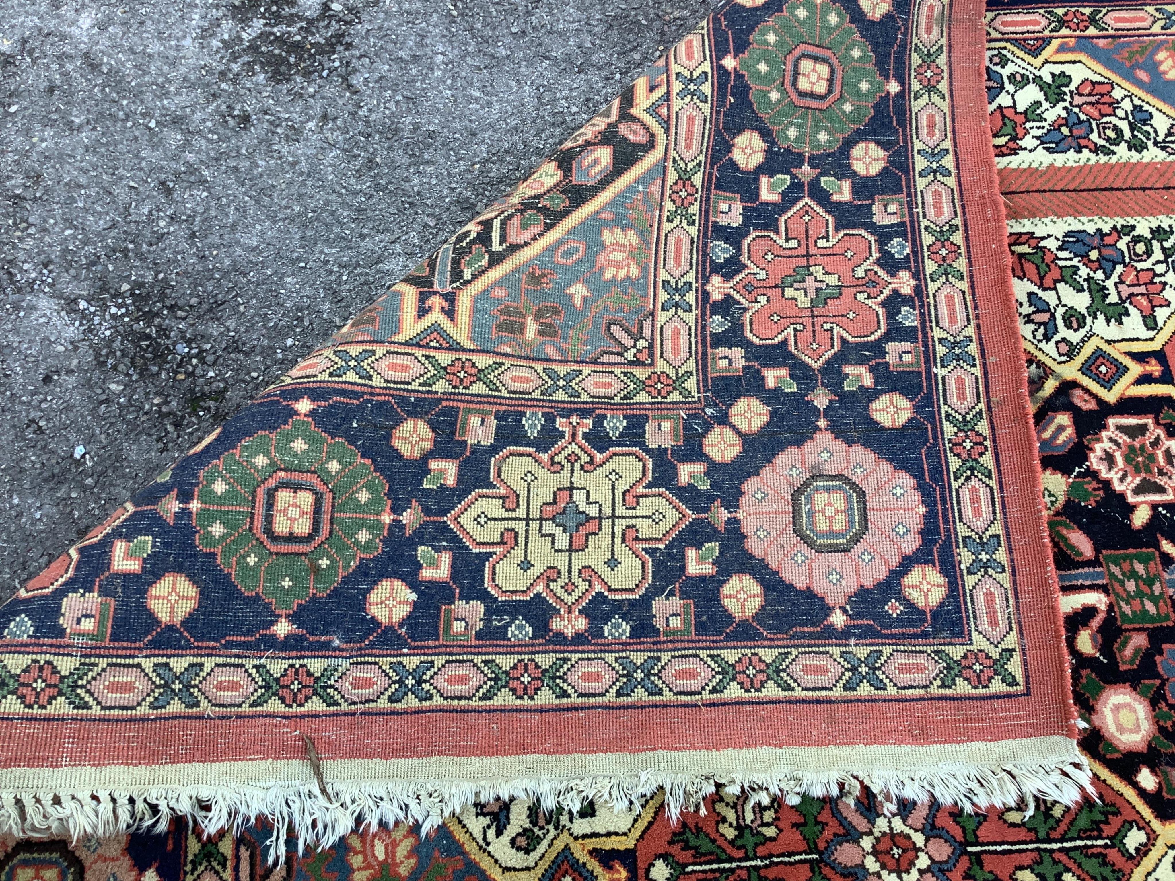 A Caucasian style brick red ground carpet, approximately 350cm x 150cm condition fair.